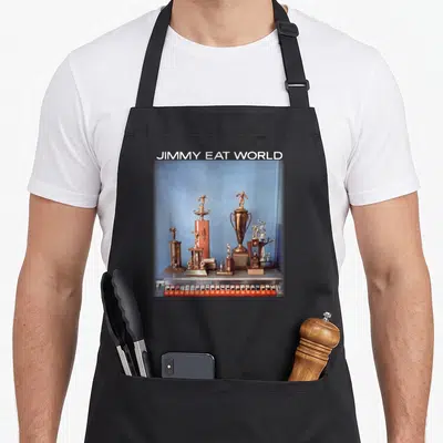 Tablier de cuisine noir avec une illustration de trophées dorés et le texte Jimmy Eat World en haut.