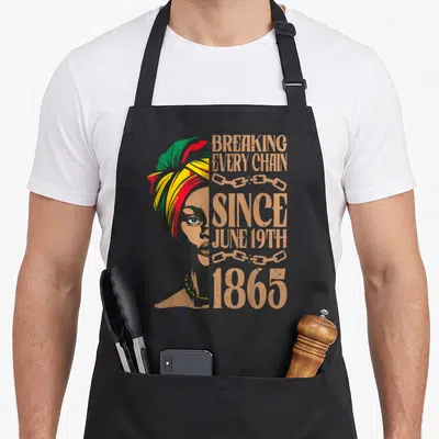Tablier de cuisine noir avec illustration d'une femme et texteBreaking Every Chain Since June 19th 1865.