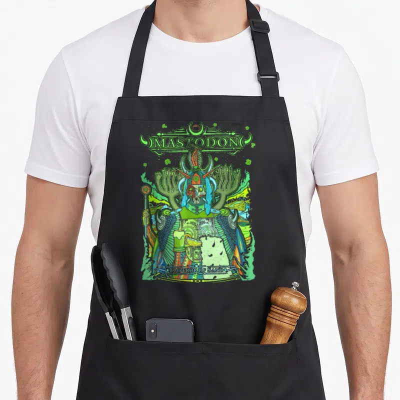 Tablier de cuisine noir avec illustration colorée d'un guerrier cornu tenant une coupe et le texte Mastodon en haut.