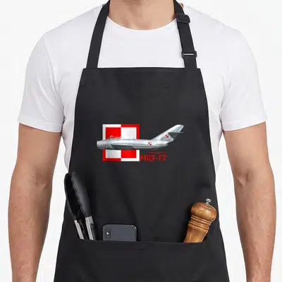 Tablier de cuisine noir avec illustration d'un Mikoyan-Gurevich MiG-17 sur fond de damier rouge et blanc polonais.