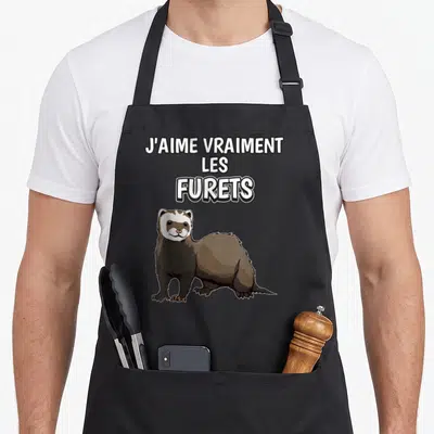 Tablier de cuisine noir avec un furet marron et blanc et le texte J'aime vraiment les Furets en lettres blanches.