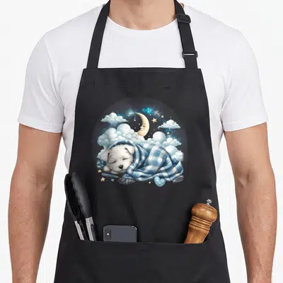 Tablier de cuisine noir avec Westie endormi sous couverture bleue, lune et étoiles en arrière-plan.
