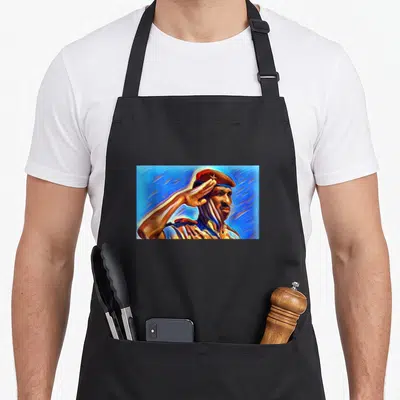 Tablier de cuisine noir avec portrait artistique coloré d'un homme en salute portant une béret rouge.