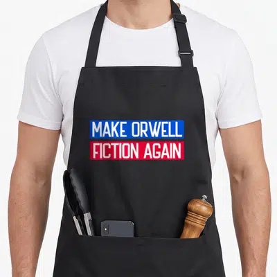 Tablier de cuisine noir avec inscription Make Orwell Fiction Again sur bandes bleue et rouge.