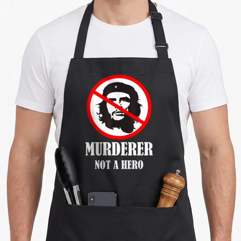Tablier de cuisine noir avec portrait barré et texte blanc Murderer Not a Hero