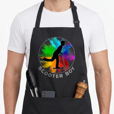 Tablier de cuisine noir avec une trottinette en silhouette noire sur fond de poudre colorée et l'inscription Scooter Boy.