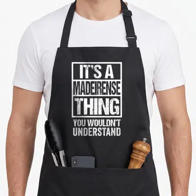 Tablier de cuisine noir avec texte blanc It's a Madeirense Thing You Wouldn't Understand encadré en typographie usée.
