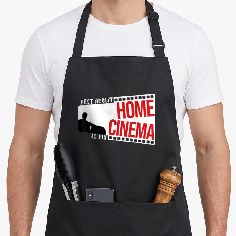 Tablier de cuisine noir avec une silhouette assise sur une bande de film blanc et rouge.