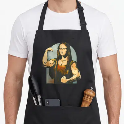 Tablier de cuisine noir avec une illustration d'une Mona Lisa Lifter Figurine flexant ses muscles.