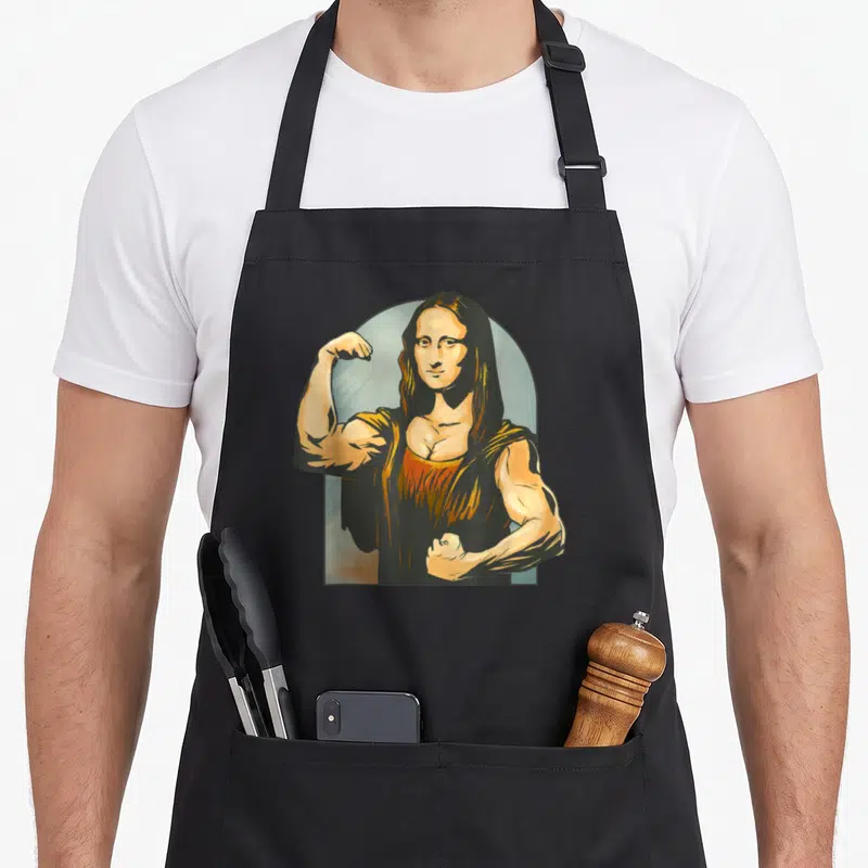 Tablier de cuisine noir avec une illustration d'une Mona Lisa Lifter Figurine flexant ses muscles.