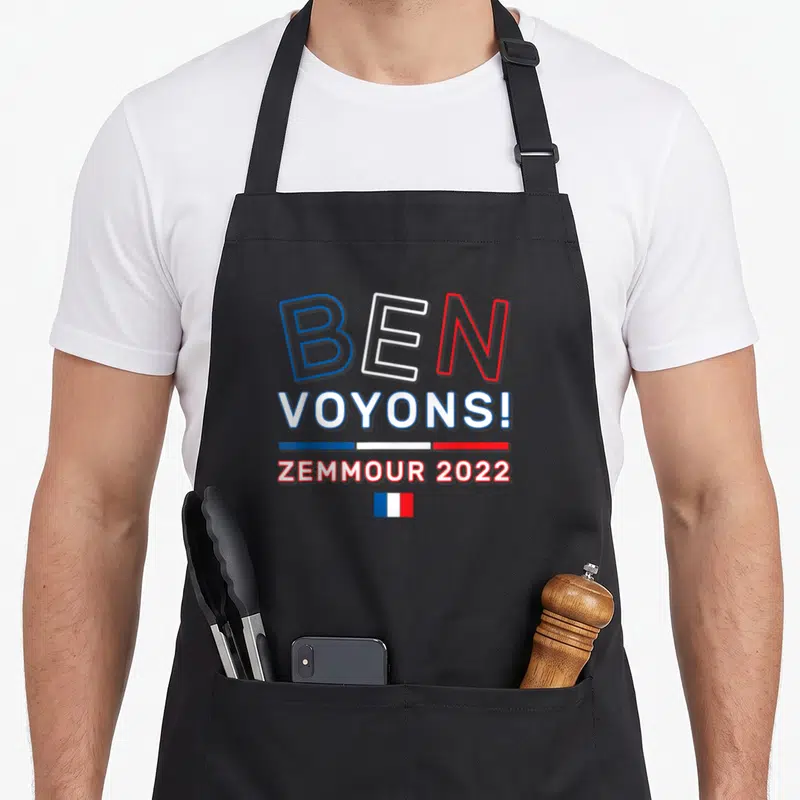 Tablier de cuisine noir avec l'inscription Ben Voyons Zemmour 2022 et drapeau français stylisé au centre.