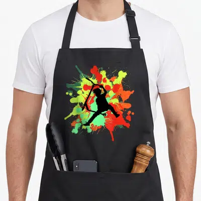 Tablier de cuisine noir avec silhouette trottinette freestyle sur éclats de peinture colorés