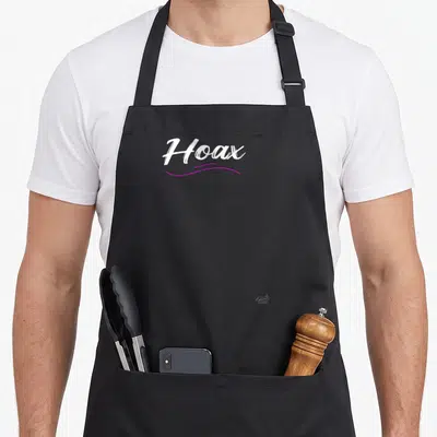 Tablier de cuisine noir avec linscription Hoax en blanc et une ligne ondulée rose sous le texte.