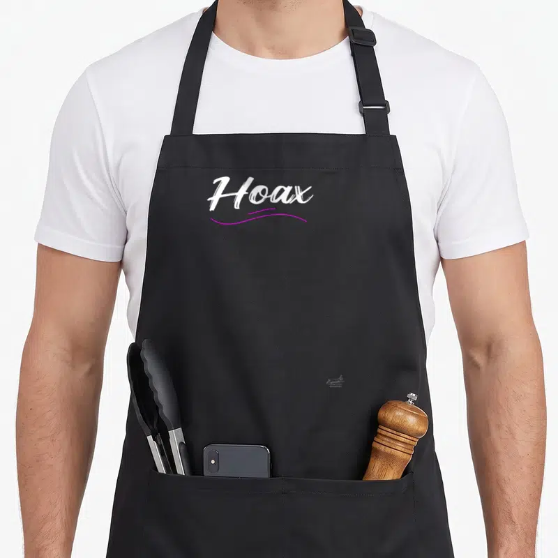 Tablier de cuisine noir avec l'inscription Hoax en blanc et une ligne ondulée rose sous le texte.