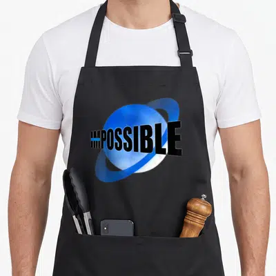 Tablier de cuisine noir avec le mot impossible barré sur une planète bleue stylisée