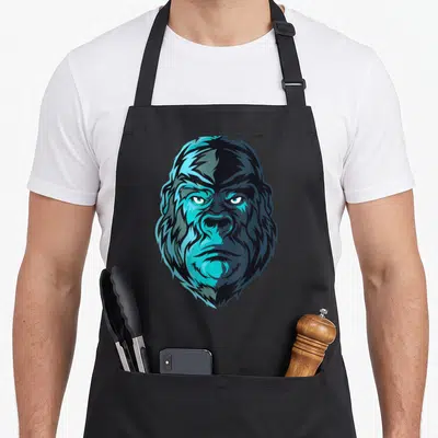 Tablier de cuisine noir avec un grand portrait de gorille aux tons bleus et noirs, style illustration vectorielle.
