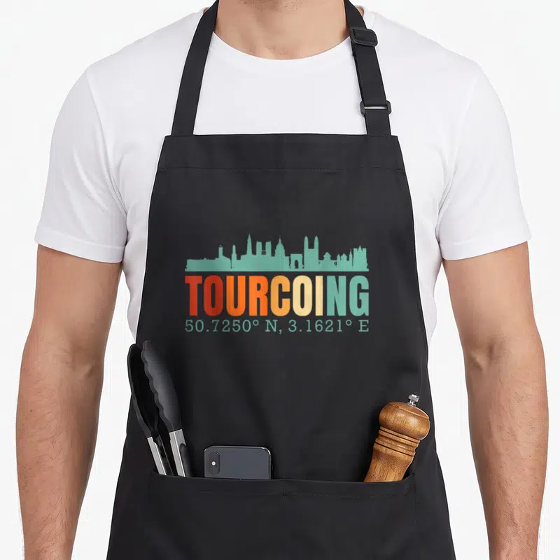Tablier de cuisine noir avec silhouette turquoise de Tourcoing et texte multicolore 50.7250° N, 3.1621° E