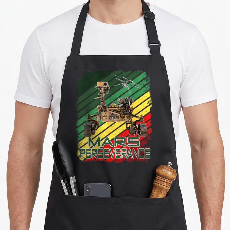 Tablier de cuisine noir avec illustration du rover Mars Perseverance et de l'hélicoptère Ingéniosité sur fond rayé coloré.