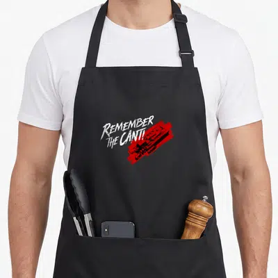 Tablier de cuisine noir avec linscriptionRemember the Cant. en blanc sur une tache rouge stylisée représentant un vaisseau spatial.