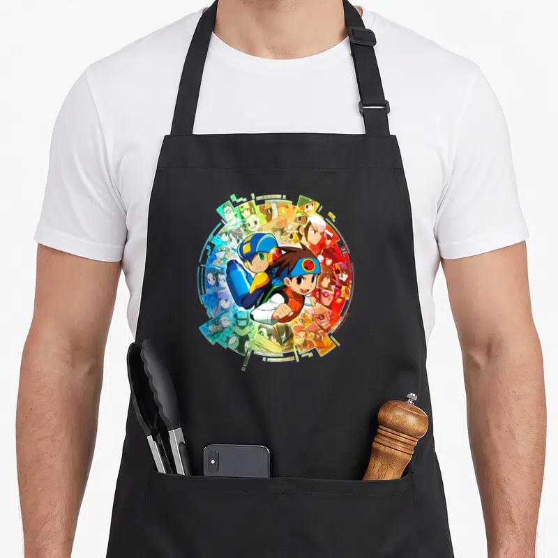 Tablier de cuisine noir avec illustration circulaire de Mega Man Battle Network et ses personnages, couleurs vives sur fond sombre.