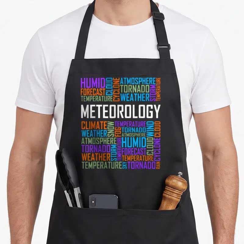 Tablier de cuisine noir avec un nuage de mots multicolores sur le thème de la météo et des phénomènes atmosphériques.