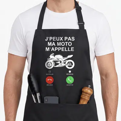 Tablier de cuisine noir avec illustration d'un téléphone affichant J'peux pas ma moto m'appelle et un sportbike blanc.