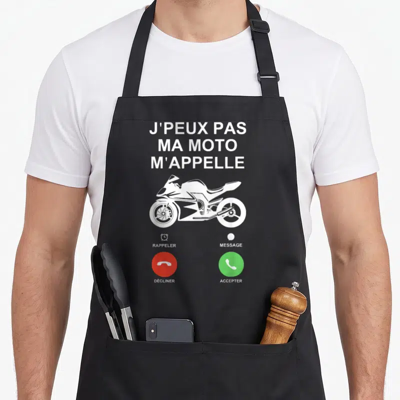 Tablier de cuisine noir avec illustration d'un téléphone affichant J'peux pas ma moto m'appelle et un sportbike blanc.