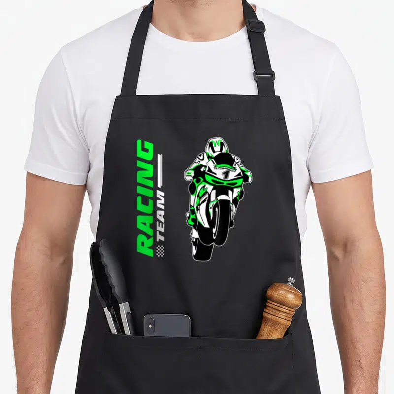 Tablier de cuisine noir avec illustration d'un cyclomoteur de course vert et blanc portant le numéro 1 et le texte Racing Team.
