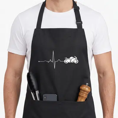 Tablier de cuisine noir avec une ligne de vie blanche se terminant par le dessin d'une moto sport.