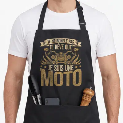 Tablier de cuisine noir avec illustration vintage d'une moto et texte doré humoristique.