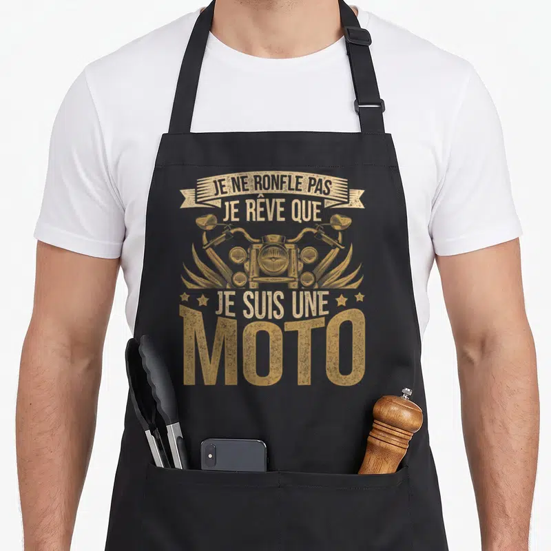 Tablier de cuisine noir avec illustration vintage d'une moto et texte doré humoristique.