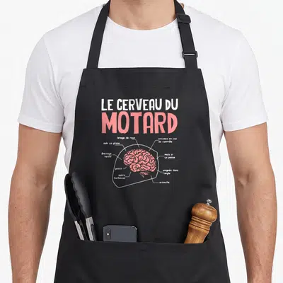 Tablier de cuisine noir avec une illustration rose et blanche représentant le cerveau du motard et ses différentes fonctions humoristiques.
