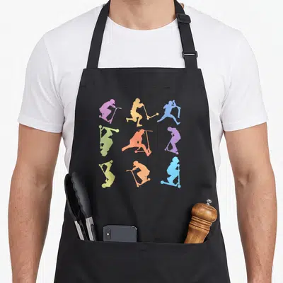 Tablier de cuisine noir avec neuf silhouettes colorées de scooters effectuant divers tricks acrobatiques.