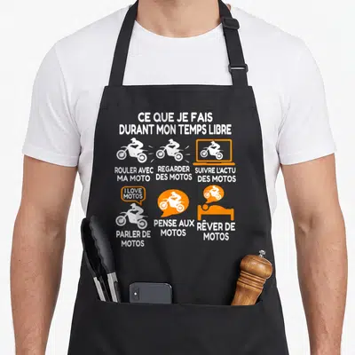 Tablier de cuisine noir avec illustrations blanches et oranges représentant des passionnés de motocyclettes et leurs loisirs quotidiens.