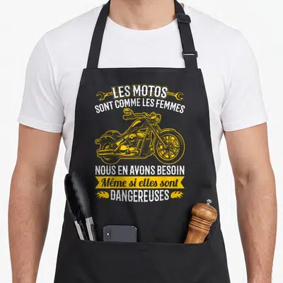 Tablier de cuisine noir avec illustration de chopper jaune et texte humoristique sur les motos et les femmes.