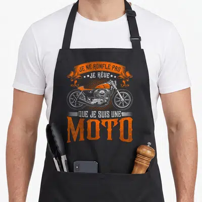 Tablier de cuisine noir avec inscription orange et illustration de moto vintage en blanc et orange.