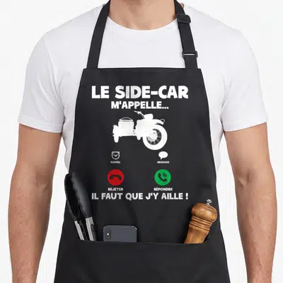 Tablier de cuisine noir avec silhouette blanche de moto à side-car et boutons d'appel téléphonique rouge et vert imprimés au centre.