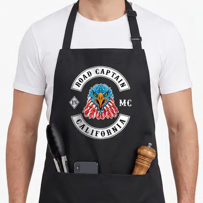 Tablier de cuisine noir avec un aigle aux plumes bleues et rouges portant l'inscription Road Captain California MC