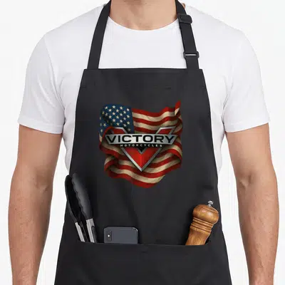 Tablier de cuisine noir avec emblème Victory Motorcycles sur fond de drapeau américain ondulé