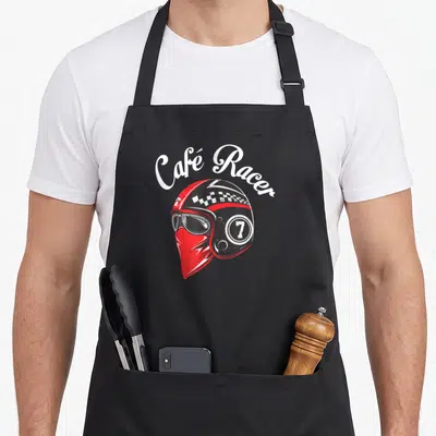 Tablier de cuisine noir avec illustration d'un casque Café Racer rouge, lunettes et bandana sous le menton.