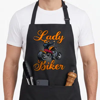 Tablier de cuisine noir avec illustration Lady Biker moto orange et femme au casque sur chopper vintage