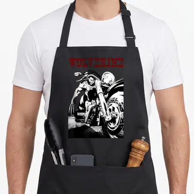 Tablier de cuisine noir avec illustration de Wolverine Young Biker en train de rouler sur sa moto avec ses griffes sortantes.