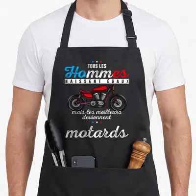 Tablier de cuisine noir avec une moto rouge et le texte tous les hommes naissent égaux mais les meilleurs deviennent motards