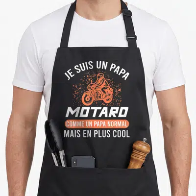 Tablier de cuisine noir avec illustration orange d'un motard et texte blanc Je suis un papa motard comme un papa normal mais en plus cool.