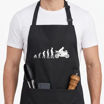 Tablier de cuisine noir avec silhouettes blanches montrant l'évolution humaine vers un motard sur moto sport.