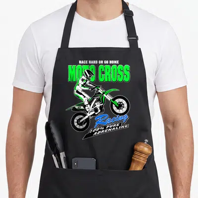 Tablier de cuisine noir avec illustration d'un pilote de motocross vert et du texte Racing 100% Pure Adrenaline.