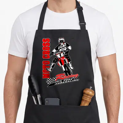 Tablier de cuisine noir avec illustration d'un pilote de motocross et l'inscription Moto Cross Racing 100% Pure Adrenaline.