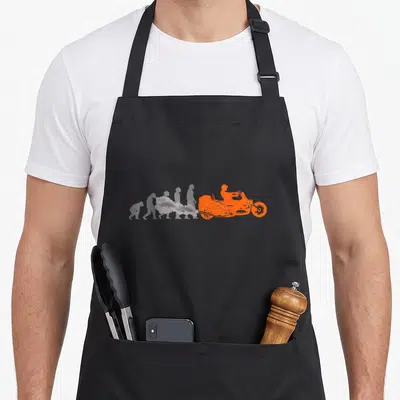 Tablier de cuisine noir avec silhouette orange d'un trike adulte émettant une fumée grise sur fond uni.