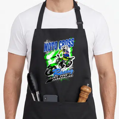 Tablier de cuisine noir avec illustration pilote motocross vert et texte Moto Cross Racing 100% Pure Adrenaline en bleu et blanc.