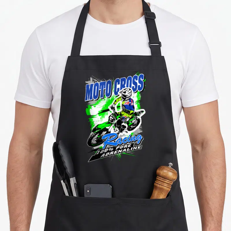 Tablier de cuisine noir avec illustration pilote motocross vert et texte Moto Cross Racing 100% Pure Adrenaline en bleu et blanc.